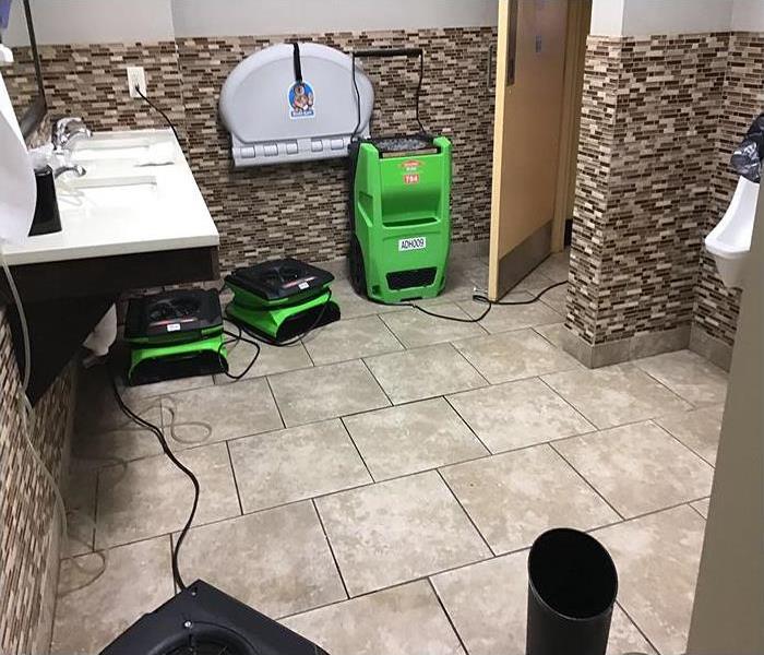 equipment drying storm damaged bathroom