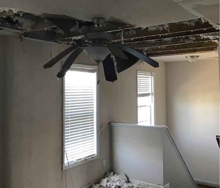 Severe ceiling damage in room with ceiling fan