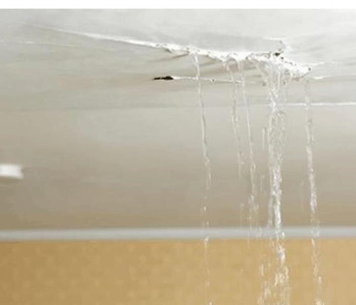 Water dripping from a damaged ceiling.