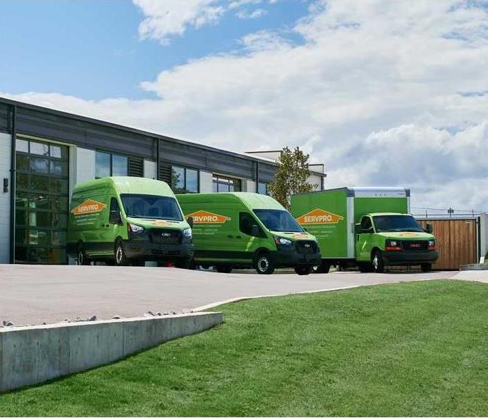 3 SERVPRO vans outside of garage and ready for deployment