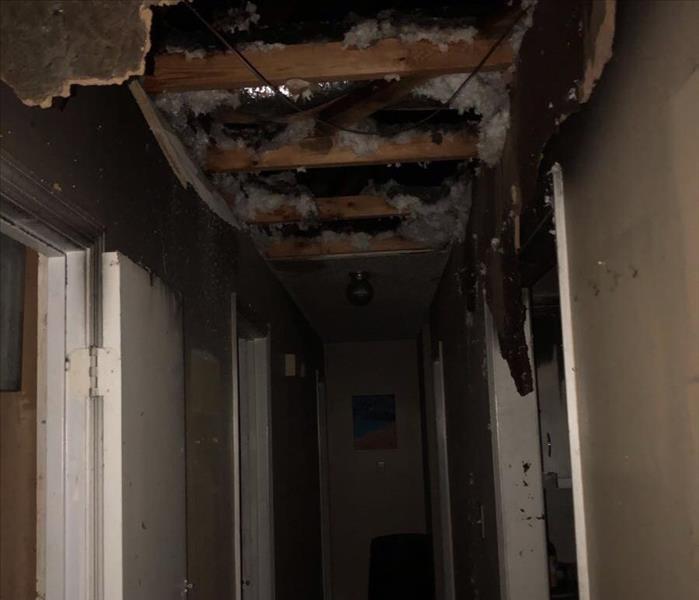fire damaged hallway of a home.